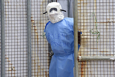 A health worker in protective suit stands at Island Hospital in Monrovia. Liberia, October 2, 2014. (Farrus/Flickr) 
