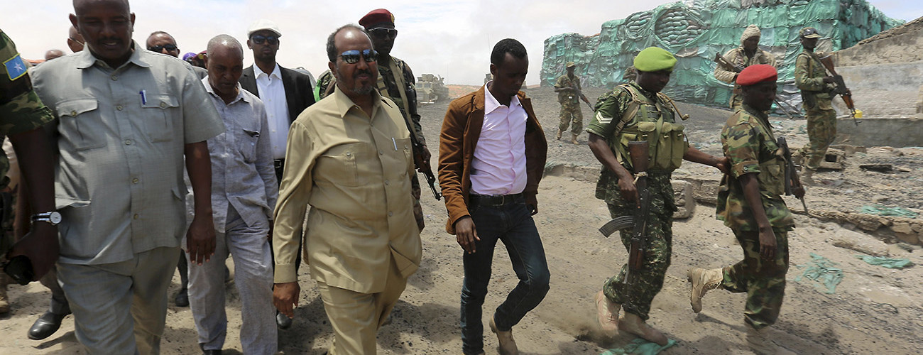 Somalian President Hassan Sheikh Mohamud (C) visits an area recaptured from Al-Shabaab extremists. Barawe, Somalia, October 12, 2014. (Feisal Omar/Reuters/Corbis)
